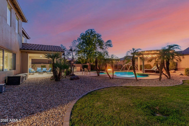 16178 W Granada Rd, Goodyear, AZ 85395 - view of jungle gym featuring a patio area, an outdoor pool, and a lawn