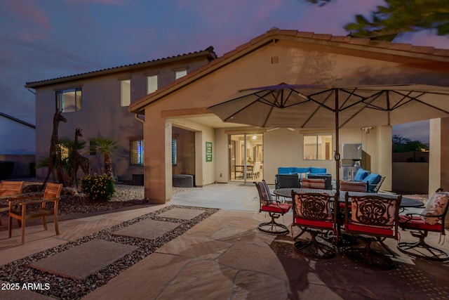 16178 W Granada Rd, Goodyear, AZ 85395 - patio terrace at dusk with an outdoor hangout area and a patio