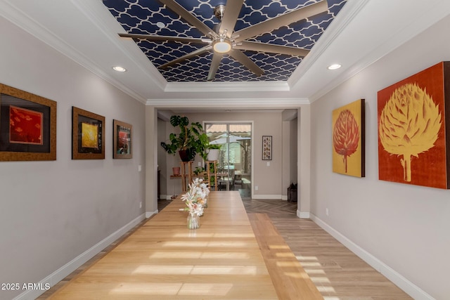 16178 W Granada Rd, Goodyear, AZ 85395 - hallway featuring a tray ceiling, ornamental molding, wood finished floors, and recessed lighting