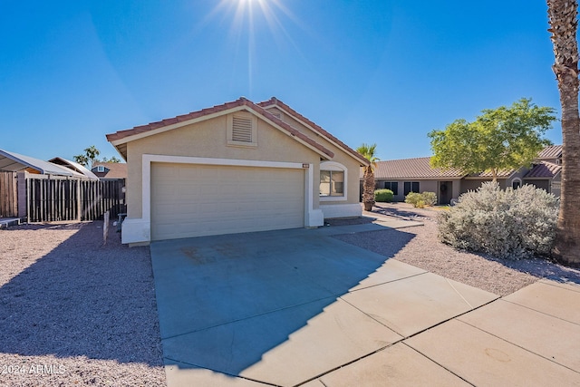 ranch-style home featuring a garage