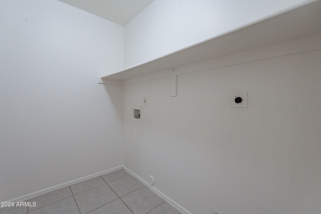 laundry room featuring hookup for an electric dryer, light tile patterned floors, hookup for a washing machine, and hookup for a gas dryer