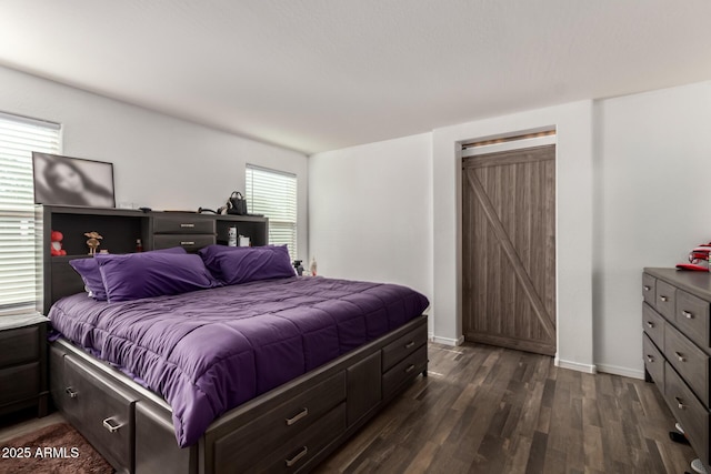 910 W Prior Ave, Coolidge, AZ 85128 - bedroom with dark wood-type flooring and baseboards