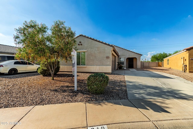 910 W Prior Ave, Coolidge, AZ 85128 - view of front facade with stucco siding, driveway, and a tiled roof