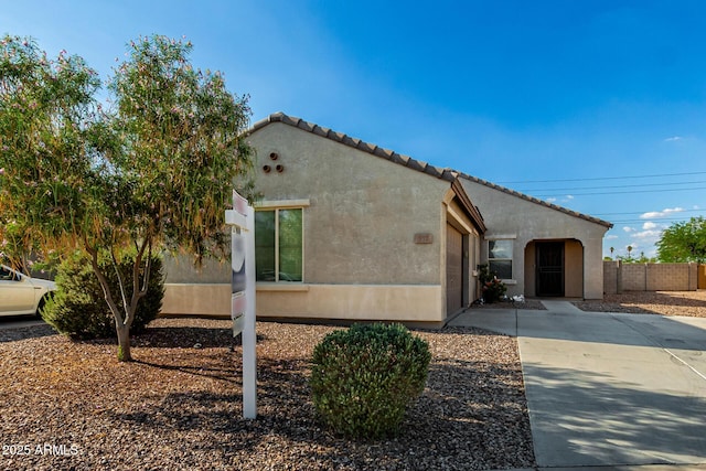 910 W Prior Ave, Coolidge, AZ 85128 - view of front of house with stucco siding and a tile roof