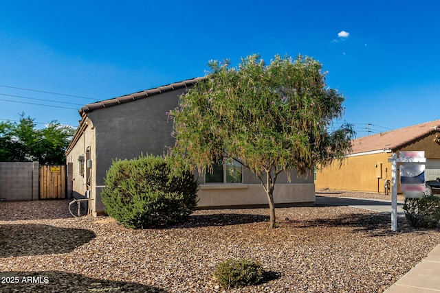 910 W Prior Ave, Coolidge, AZ 85128 - view of side of home featuring stucco siding