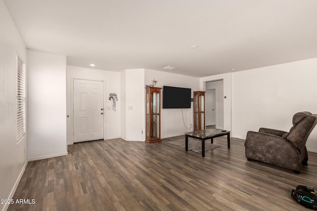 910 W Prior Ave, Coolidge, AZ 85128 - living room with wood finished floors, baseboards, and recessed lighting