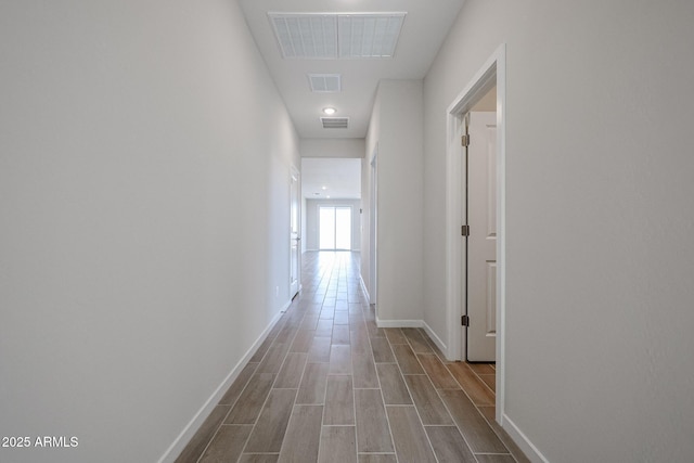39965 W Sparks Ln, Maricopa, AZ 85138 - hallway featuring baseboards and dark wood-style flooring