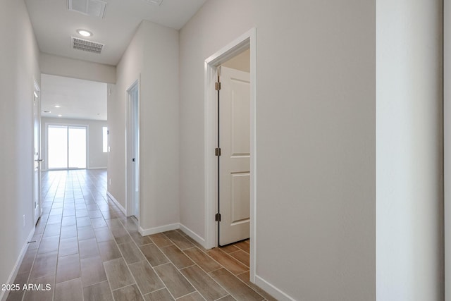 39965 W Sparks Ln, Maricopa, AZ 85138 - corridor with baseboards, wood finished floors, and recessed lighting