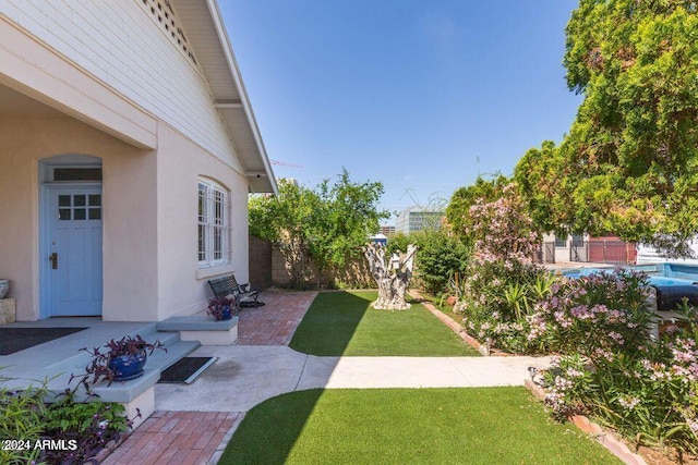 view of yard with fence and a patio