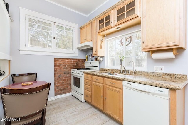 kitchen with a sink, light wood-type flooring, white appliances, light brown cabinetry, and under cabinet range hood