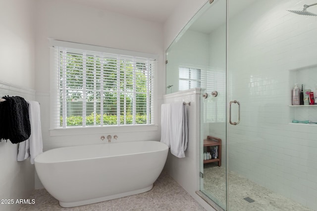 6196 E Calle Camelia, Scottsdale, AZ 85251 - bathroom featuring a shower stall, a soaking tub, and tile walls