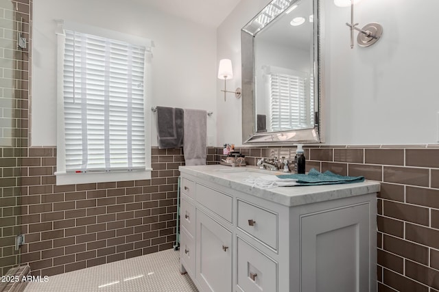 6196 E Calle Camelia, Scottsdale, AZ 85251 - bathroom featuring tile walls, wainscoting, vanity, and tile patterned floors
