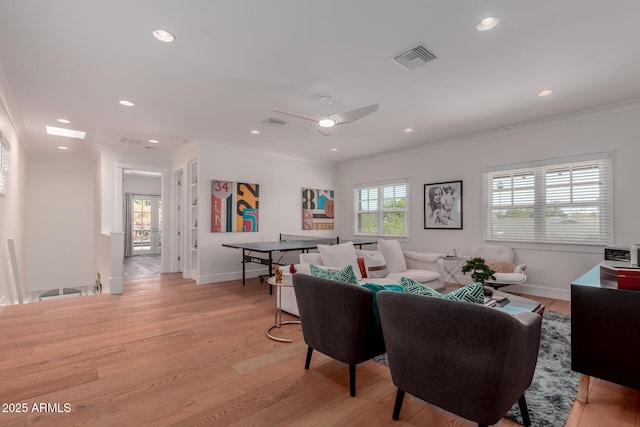 6196 E Calle Camelia, Scottsdale, AZ 85251 - living room with light wood-type flooring, crown molding, baseboards, a ceiling fan, and recessed lighting