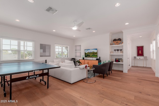 6196 E Calle Camelia, Scottsdale, AZ 85251 - living area featuring light wood-style flooring, a ceiling fan, crown molding, recessed lighting, and baseboards
