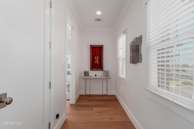 6196 E Calle Camelia, Scottsdale, AZ 85251 - hallway with healthy amount of natural light, crown molding, light wood finished floors, and baseboards