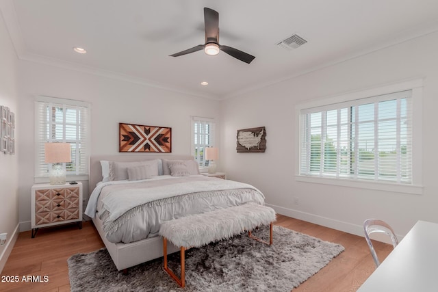 6196 E Calle Camelia, Scottsdale, AZ 85251 - bedroom featuring multiple windows, crown molding, baseboards, light wood-style floors, and recessed lighting
