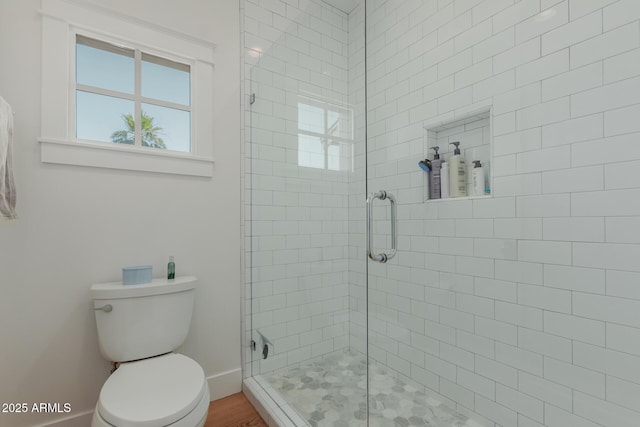 6196 E Calle Camelia, Scottsdale, AZ 85251 - bathroom with plenty of natural light, a shower stall, toilet, and baseboards