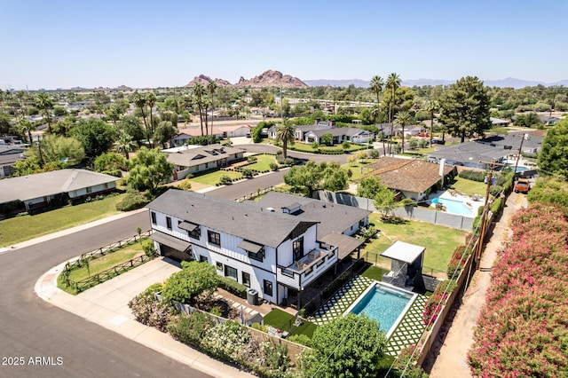 6196 E Calle Camelia, Scottsdale, AZ 85251 - aerial perspective of suburban area featuring a pool area and a mountain backdrop