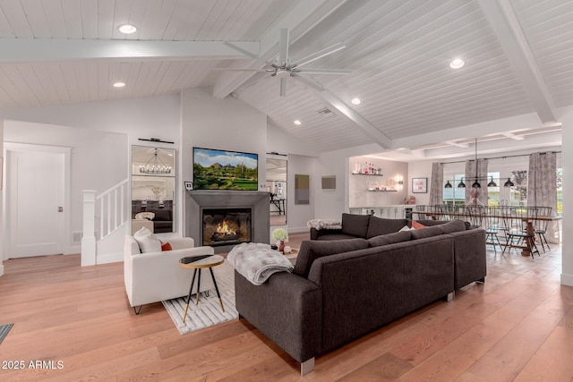 6196 E Calle Camelia, Scottsdale, AZ 85251 - living area with light wood-style floors, a ceiling fan, recessed lighting, stairs, and a glass covered fireplace