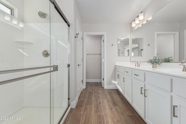 bathroom with vanity and an enclosed shower