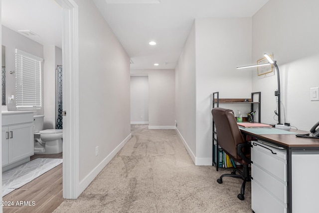 office space with light colored carpet