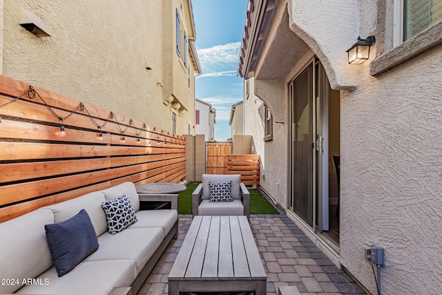 balcony featuring outdoor lounge area and a patio area