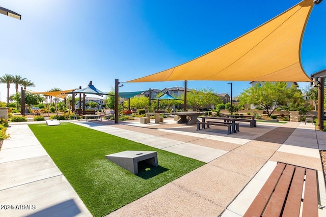 surrounding community with a gazebo and a lawn