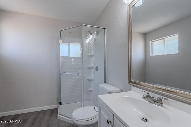 full bathroom with toilet, a shower stall, wood finished floors, and vanity