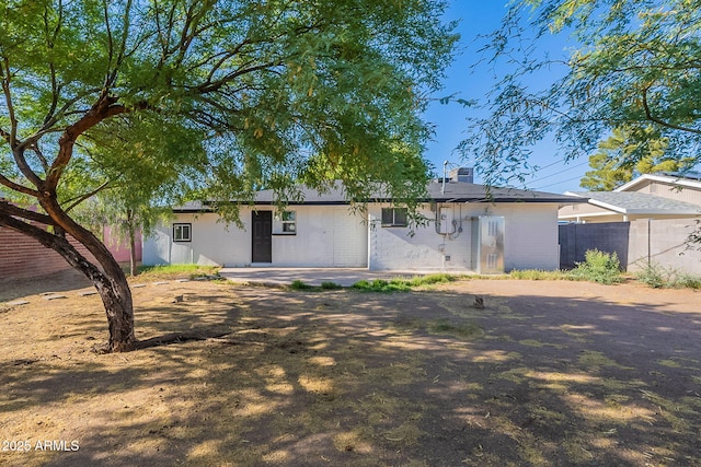 view of front of property featuring fence and a chimney