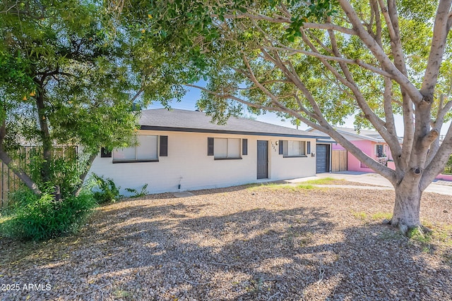 single story home featuring a garage