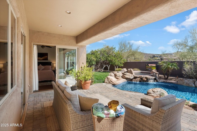 view of swimming pool with a jacuzzi, fence, a fenced in pool, and a patio