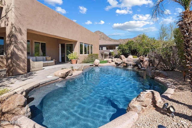 pool with outdoor lounge area and a patio