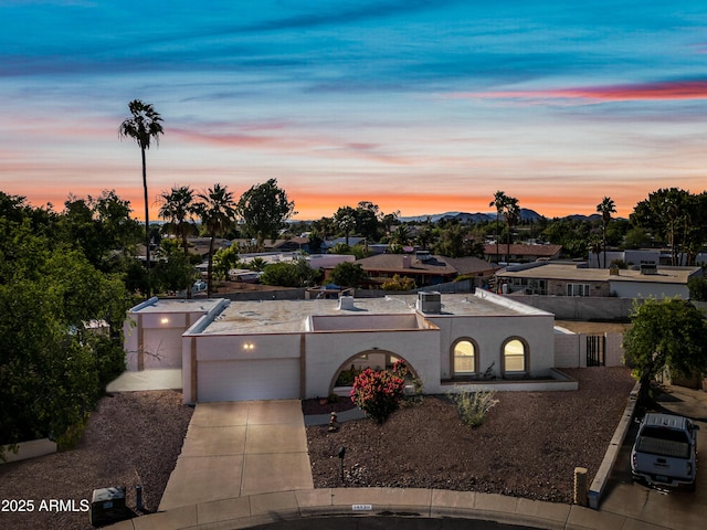 14830 N 28th Pl, Phoenix, AZ 85032 - view of front facade with concrete driveway, an attached garage, and stucco siding