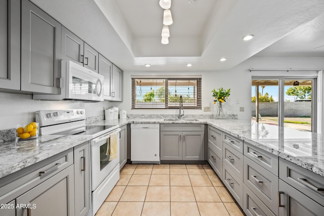 14830 N 28th Pl, Phoenix, AZ 85032 - kitchen with white appliances, gray cabinets, recessed lighting, light tile patterned flooring, and light stone countertops