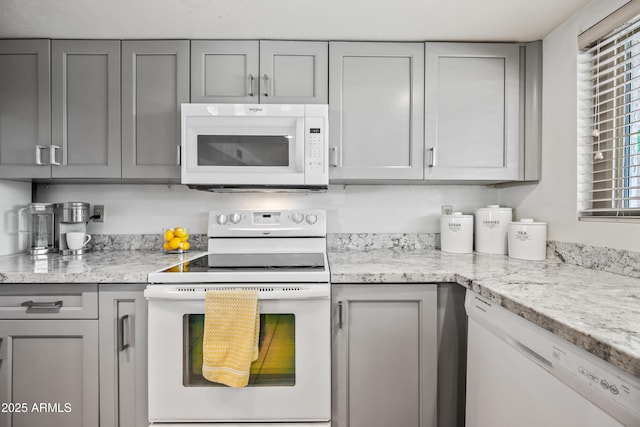 14830 N 28th Pl, Phoenix, AZ 85032 - kitchen with white appliances, gray cabinetry, and light stone countertops