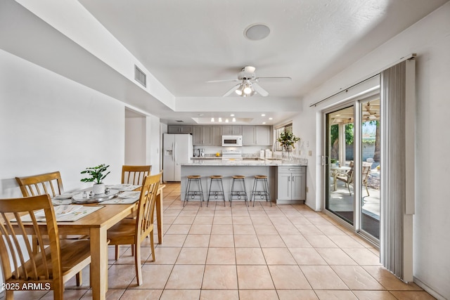14830 N 28th Pl, Phoenix, AZ 85032 - dining area featuring ceiling fan and light tile patterned floors