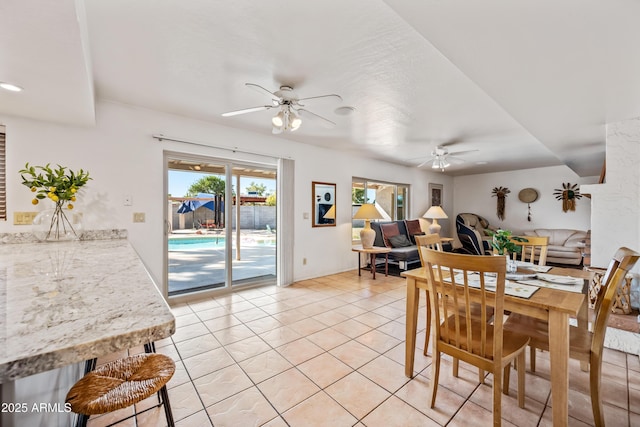 14830 N 28th Pl, Phoenix, AZ 85032 - dining space with ceiling fan and light tile patterned floors