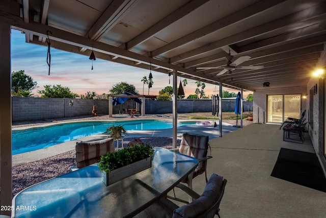 14830 N 28th Pl, Phoenix, AZ 85032 - pool at dusk with a fenced backyard and a patio