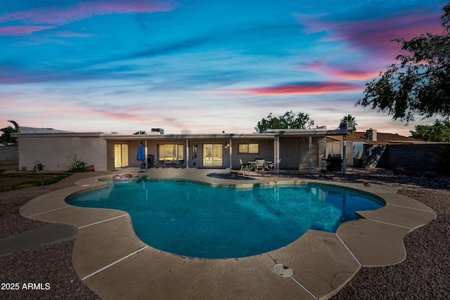 14830 N 28th Pl, Phoenix, AZ 85032 - pool at dusk with a patio area and grilling area
