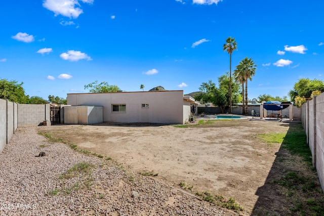 14830 N 28th Pl, Phoenix, AZ 85032 - back of house featuring a fenced backyard and a patio area