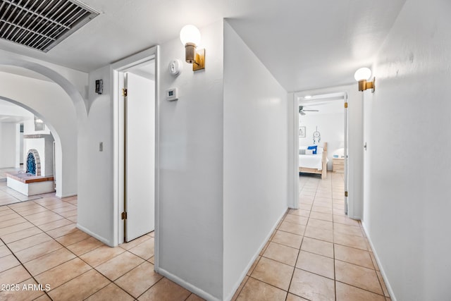 14830 N 28th Pl, Phoenix, AZ 85032 - hall with light tile patterned floors and arched walkways