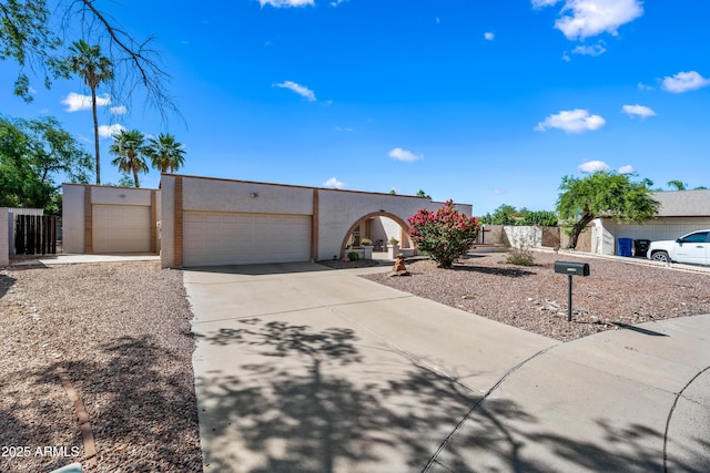 14830 N 28th Pl, Phoenix, AZ 85032 - view of front of house featuring stucco siding, concrete driveway, and a garage