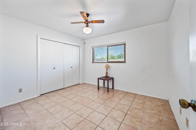 14830 N 28th Pl, Phoenix, AZ 85032 - unfurnished bedroom with a closet, light tile patterned flooring, and ceiling fan