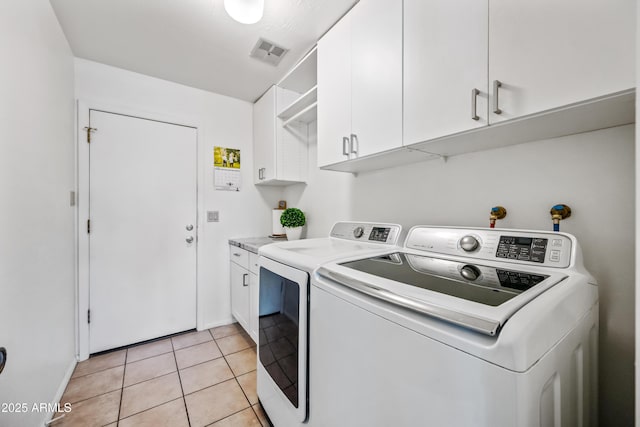 14830 N 28th Pl, Phoenix, AZ 85032 - washroom featuring cabinet space, independent washer and dryer, and light tile patterned floors