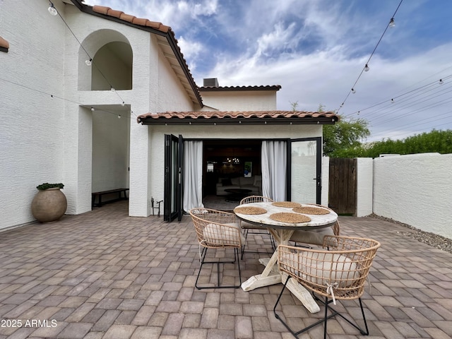 5556 E Sandra Ter, Scottsdale, AZ 85254 - view of patio featuring a gate and outdoor dining area