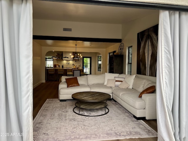 5556 E Sandra Ter, Scottsdale, AZ 85254 - living room featuring wood finished floors and a chandelier