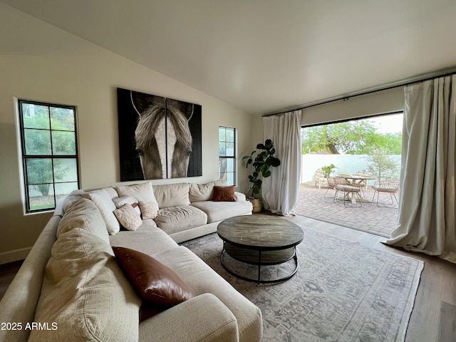 5556 E Sandra Ter, Scottsdale, AZ 85254 - living area featuring wood finished floors and lofted ceiling