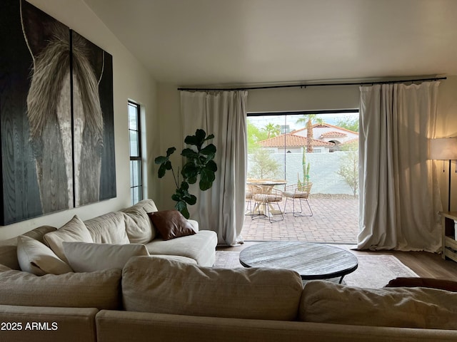 5556 E Sandra Ter, Scottsdale, AZ 85254 - living room with plenty of natural light, wood finished floors, and lofted ceiling
