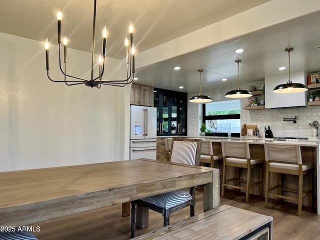 5556 E Sandra Ter, Scottsdale, AZ 85254 - dining space featuring light wood-type flooring, recessed lighting, and a chandelier