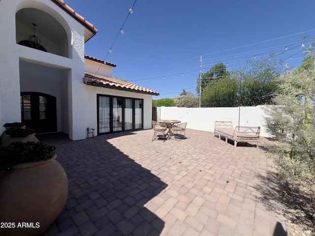 5556 E Sandra Ter, Scottsdale, AZ 85254 - view of patio / terrace featuring french doors and outdoor dining space